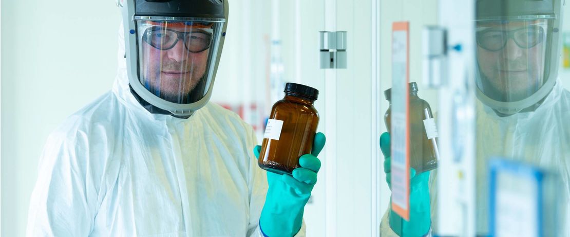 Lipids for BioNTech's Covid-19 vaccine: Chemist Mathias Günther with a bottled lipid batch in Evonik's lipid production in Hanau